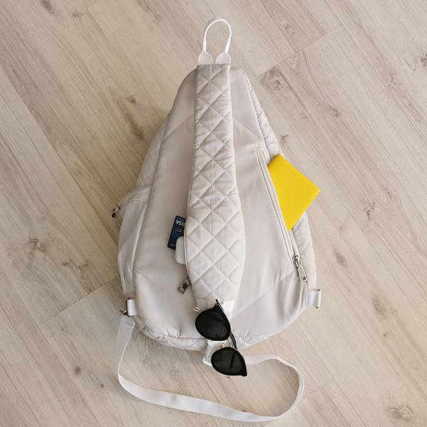 Light Beige Quilted Nylon Sling Bag, Lightweight Everyday Crossbody Travel Backpack with Hidden Pockets and Bottle Holder